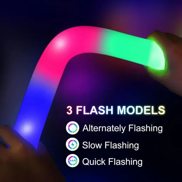 Multicolored flashing glow stick in hand.