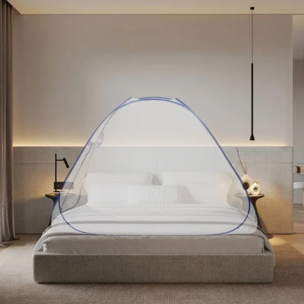 Bed with blue mosquito net canopy.