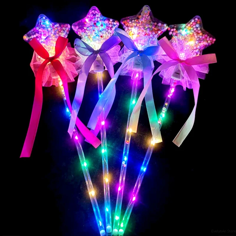 Four colorful LED star wands with ribbons.