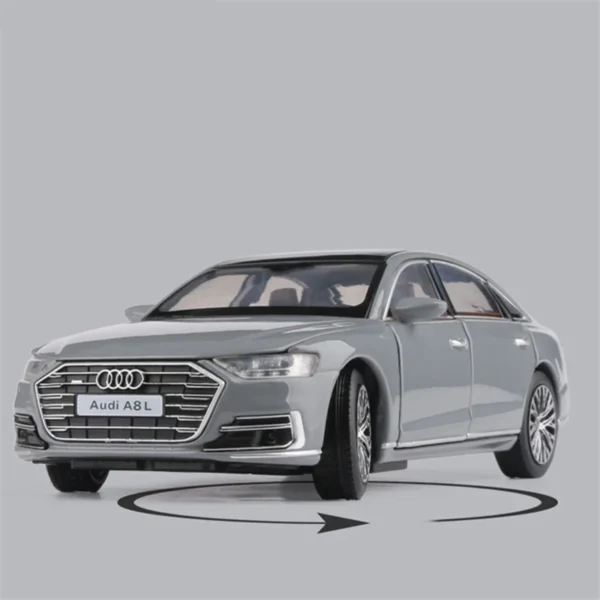 Grey Audi A8L toy car on grey background.