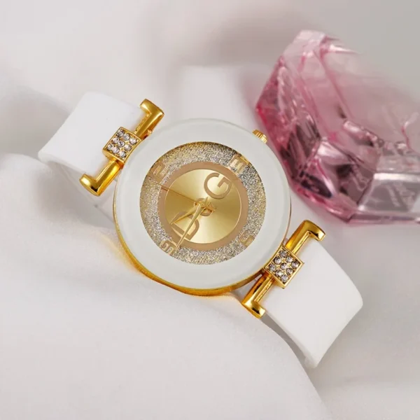 White and gold watch with diamond accents.