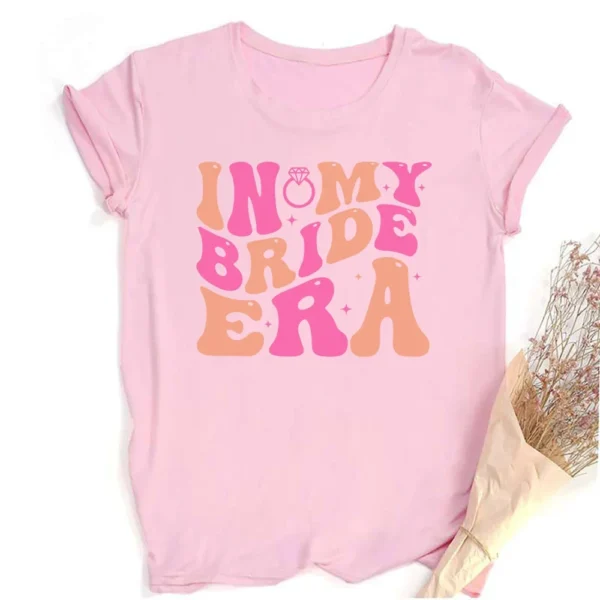 Pink t-shirt with "In My Bride Era" design.