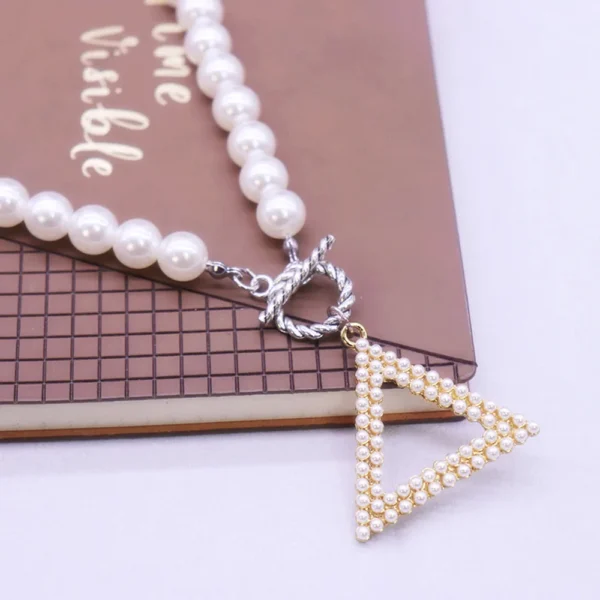 Pearl necklace with triangle pendant.