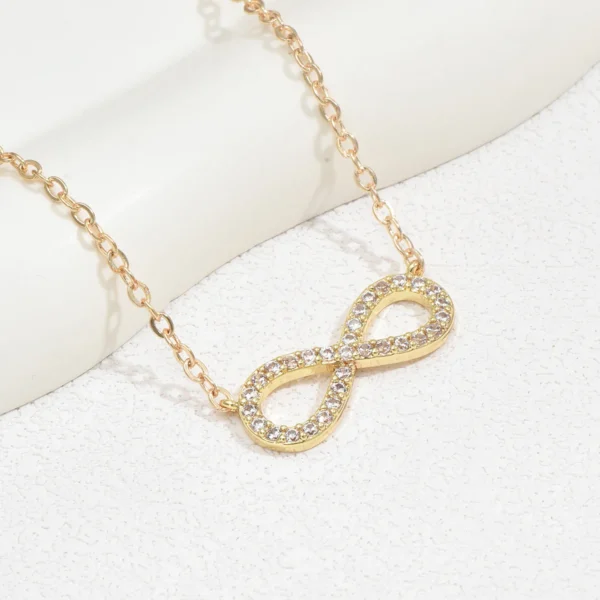 Gold infinity necklace with cz stones.