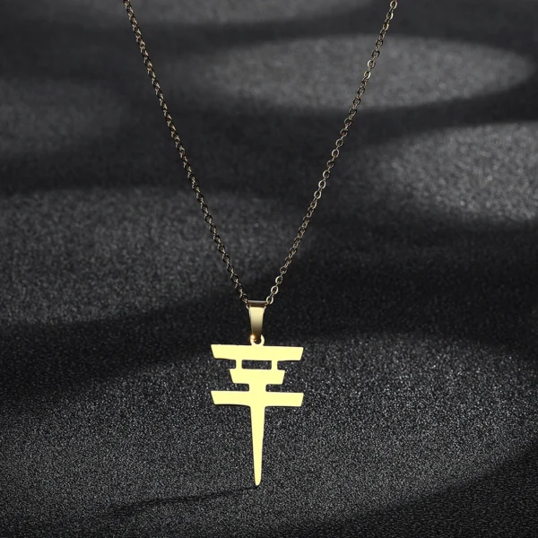 Gold chain with peace sign pendant.