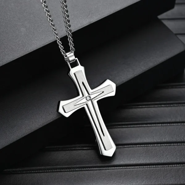 Silver cross pendant with chain necklace.