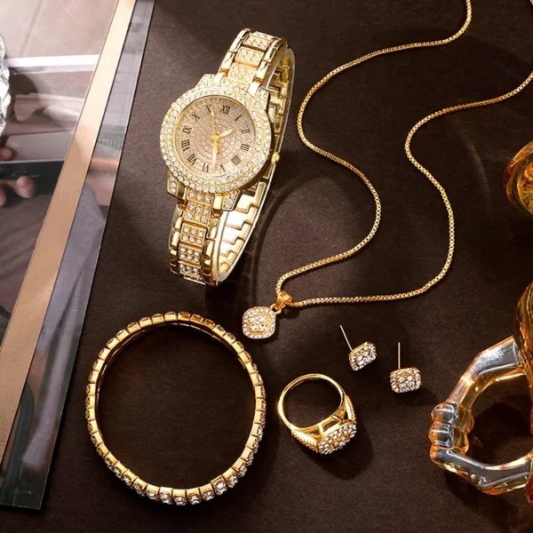 Gold watch, necklace, bracelet and earrings.