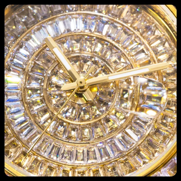 Diamond-encrusted watch face with gold hands.