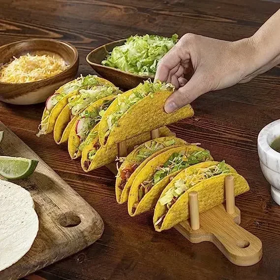 Wooden taco stand with filled tacos.