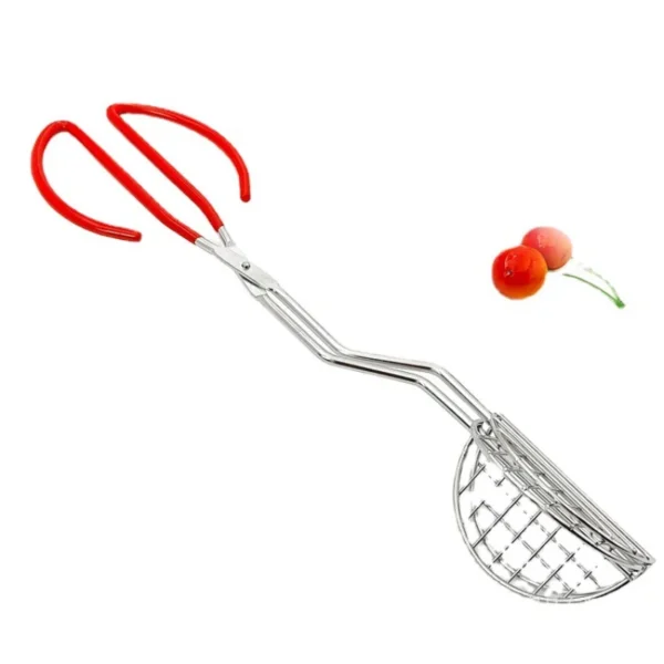 Red handled cherry pitter tongs.