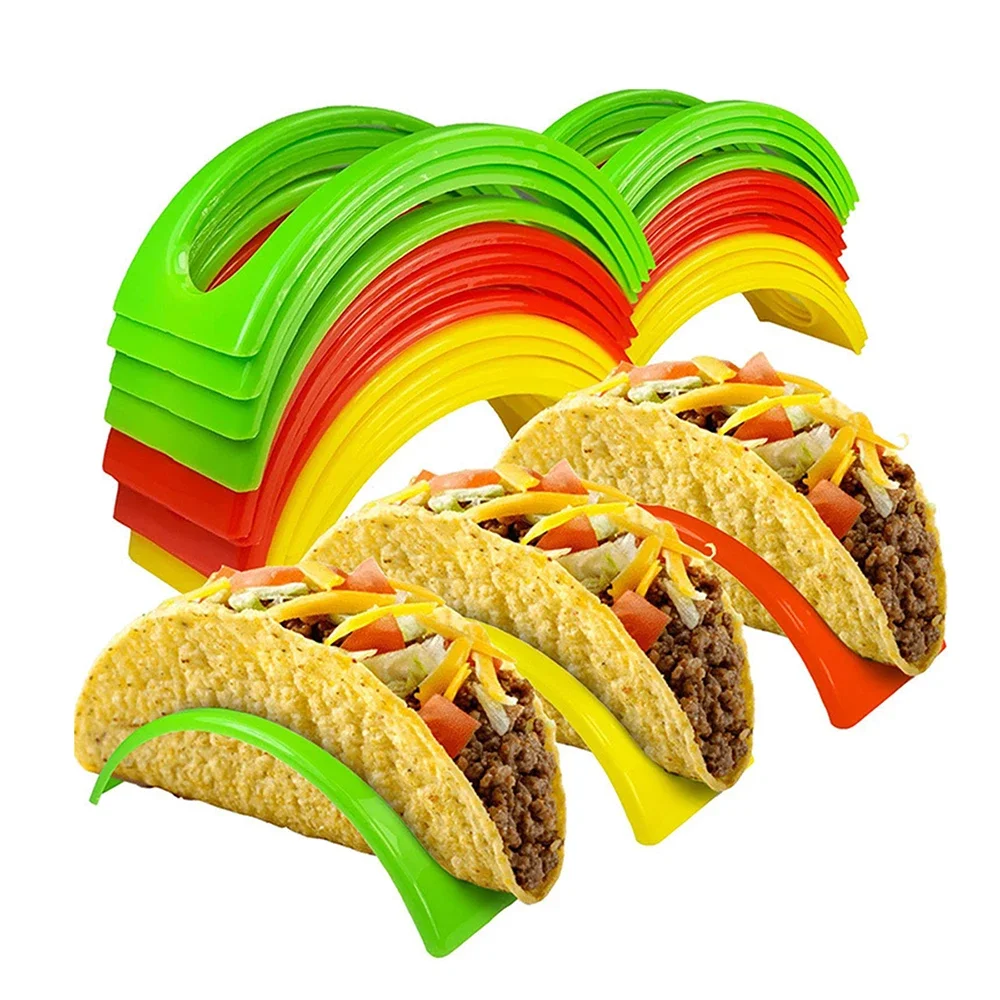 Three tacos in colorful plastic holders.