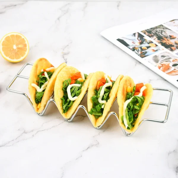 Taco shells in a metal holder.