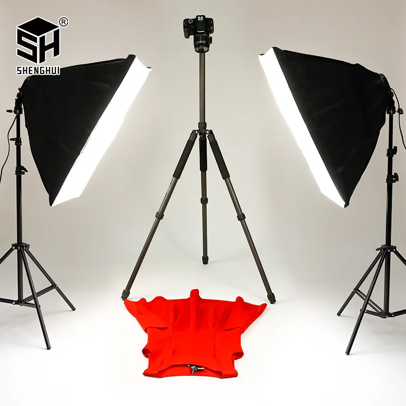 Photography studio setup with red dress.