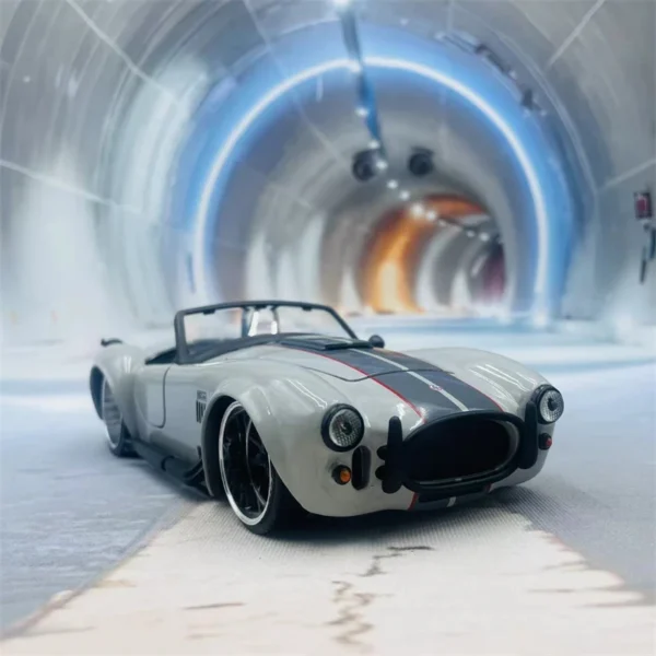 Gray convertible sports car in a tunnel.