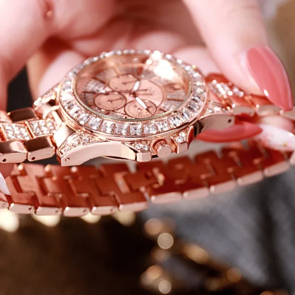 Rose gold watch with diamond accents.