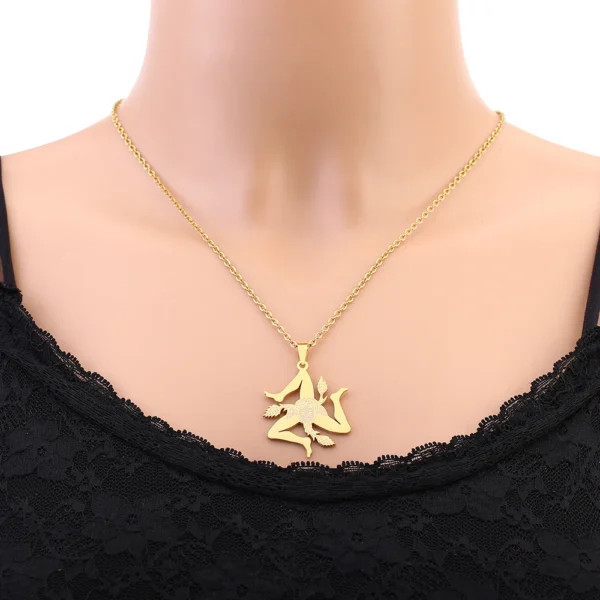 Gold necklace with a Trinacria pendant.