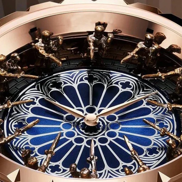 Rose gold clock face with blue details.