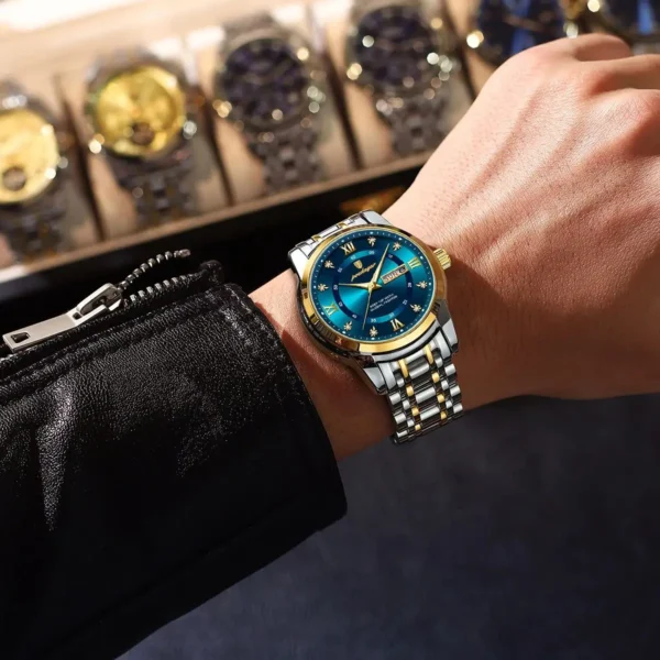 Gold and silver wristwatch with blue face.