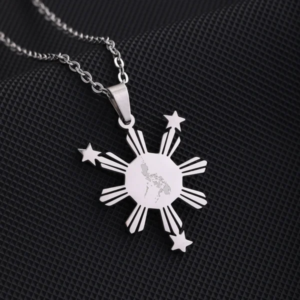 Silver necklace with Philippine sun design.