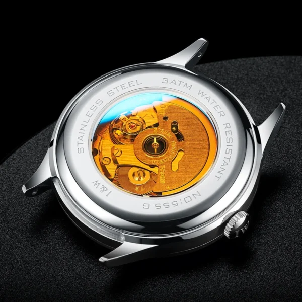 Stainless steel watch with exposed movement.