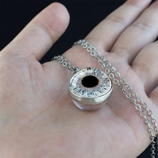 Silver chain necklace with eye pendant.