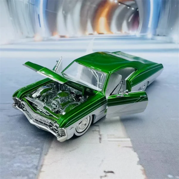 Green custom model car with open hood.