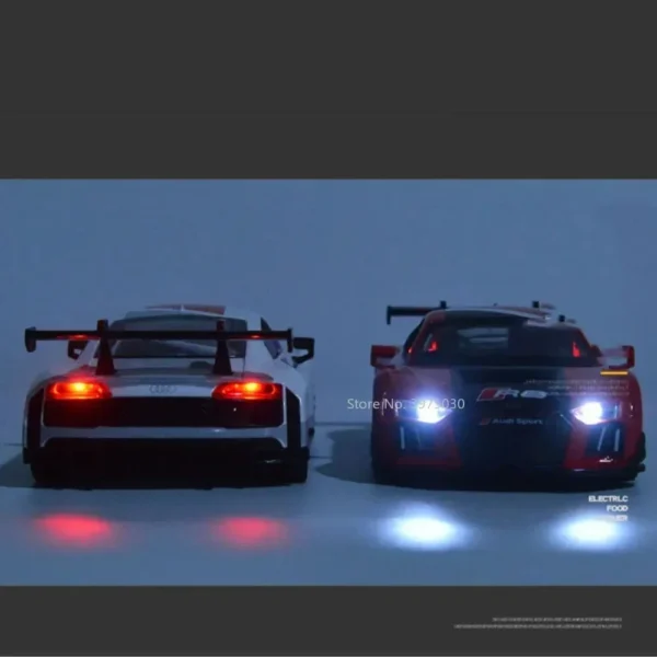 Two toy Audi R8 race cars with headlights on.