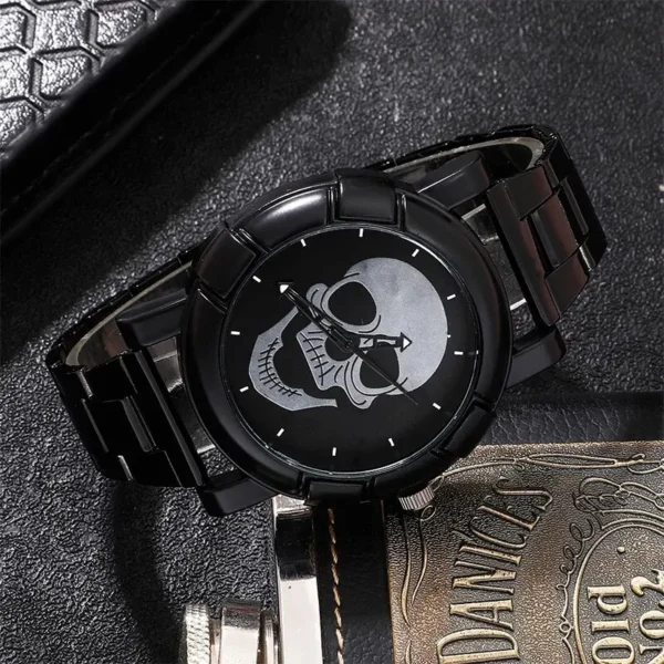 Black skull watch with metal band.