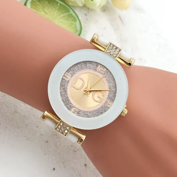 White wristwatch with gold accents and DG logo.