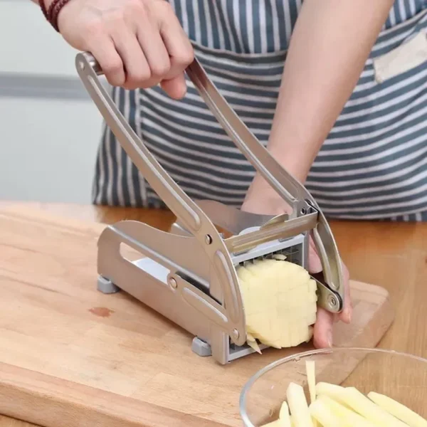 Person using potato chipper to make fries.