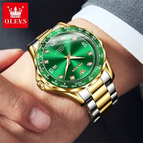 Gold and silver watch with green face.