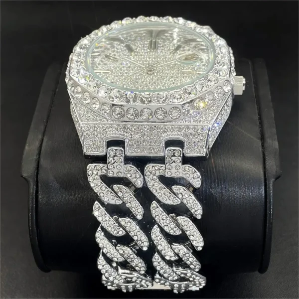 Diamond-encrusted silver wristwatch with Cuban chain.