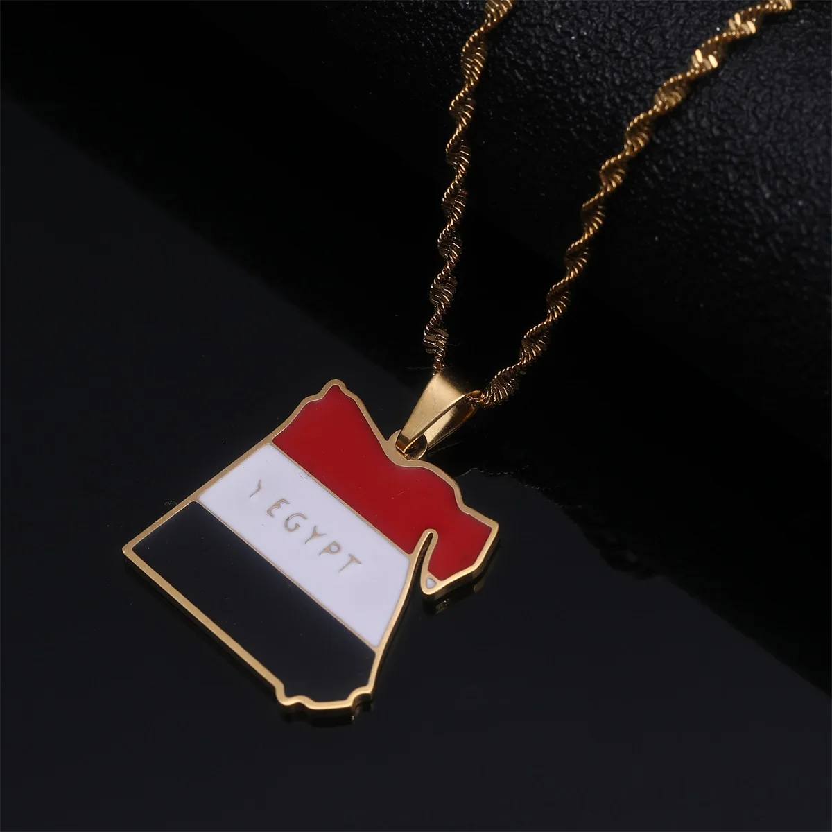 Gold chain with Egypt map pendant.