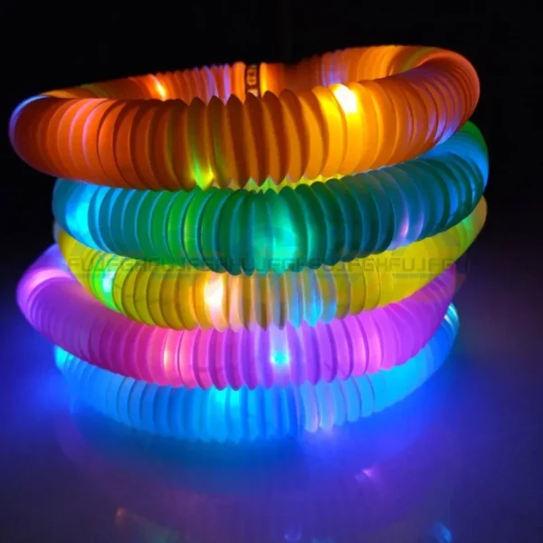 Stack of colorful LED bracelets.