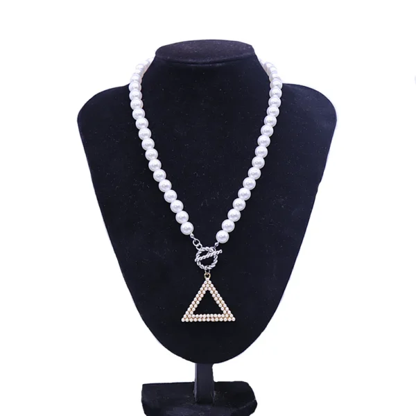 Pearl necklace with triangle pendant.