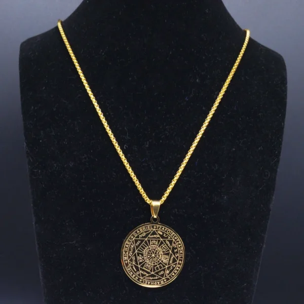 Gold necklace with engraved pendant.