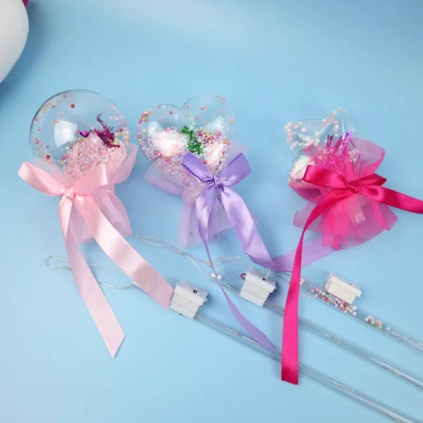 Three fairy wands with light up flowers.