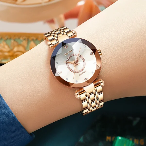 Gold wristwatch with diamond accents.