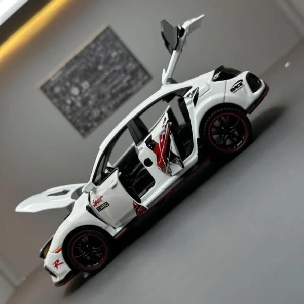 White toy car with open doors.