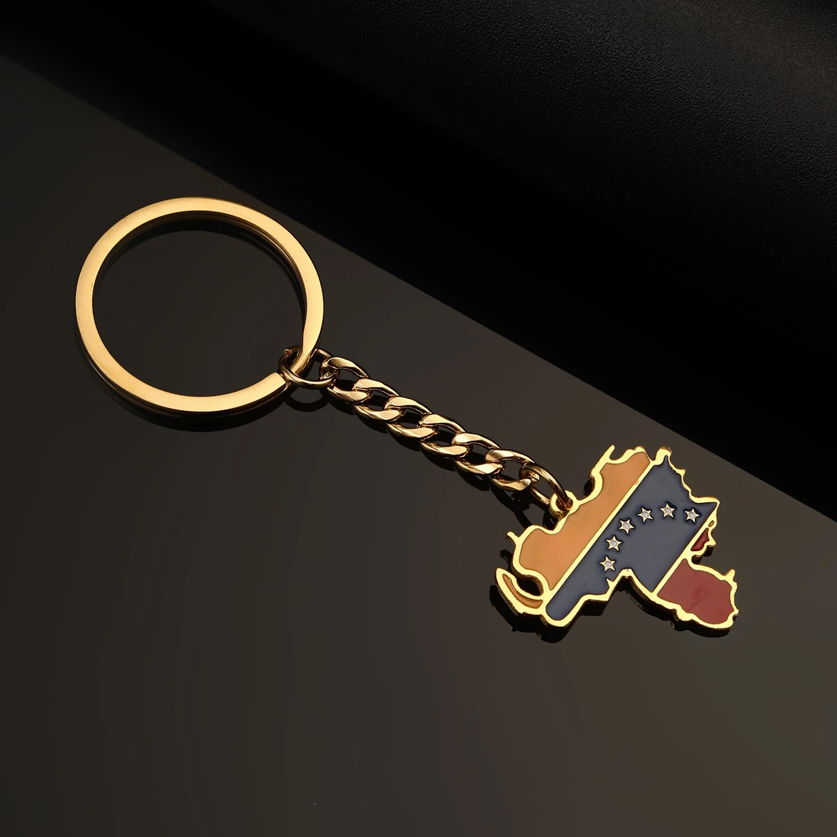 Gold Venezuela keychain with flag.