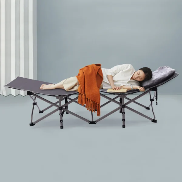 Woman sleeping on a folding cot.