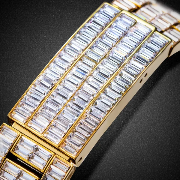 Gold watch band with baguette diamonds.