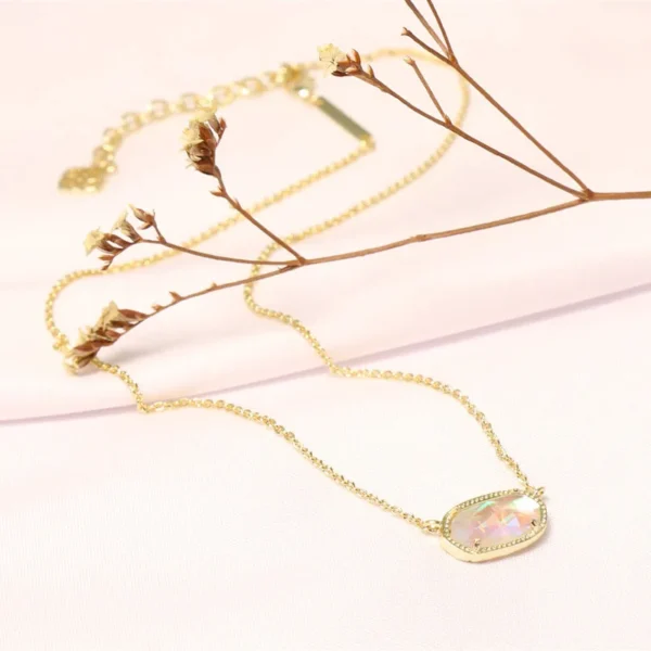 Gold chain with iridescent gemstone pendant.