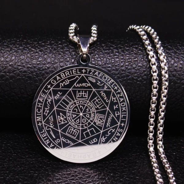 Silver pendant necklace with engraved symbols.