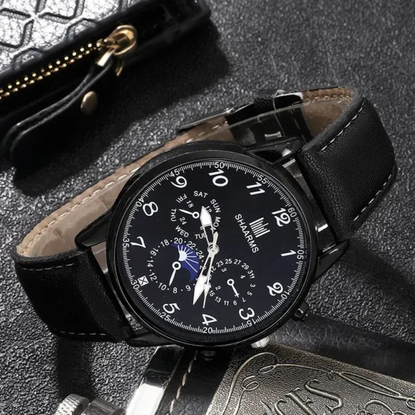 Black leather wristwatch with moon phase.