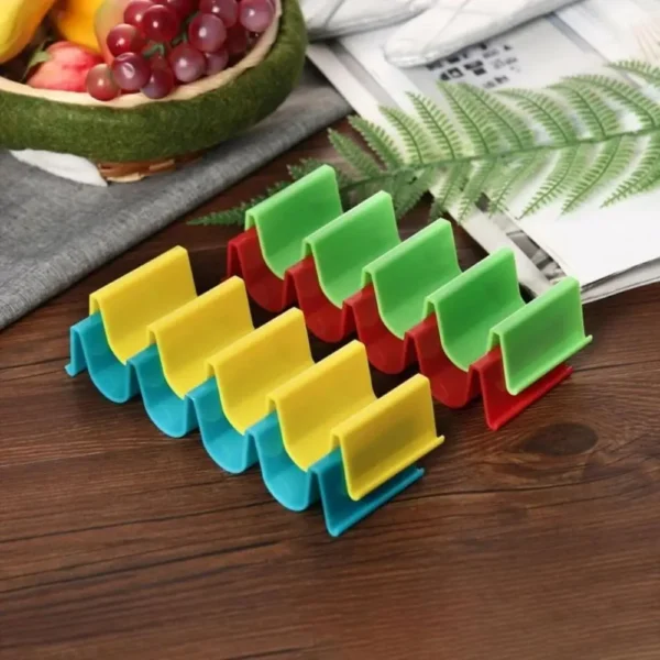 Colorful plastic can organizers on a table.