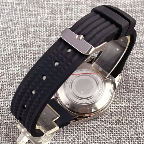 Black rubber watch strap with silver buckle.