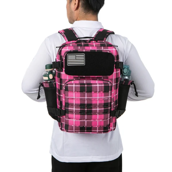 Man wearing pink and black plaid backpack.