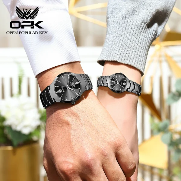 Couple wearing matching black wristwatches.