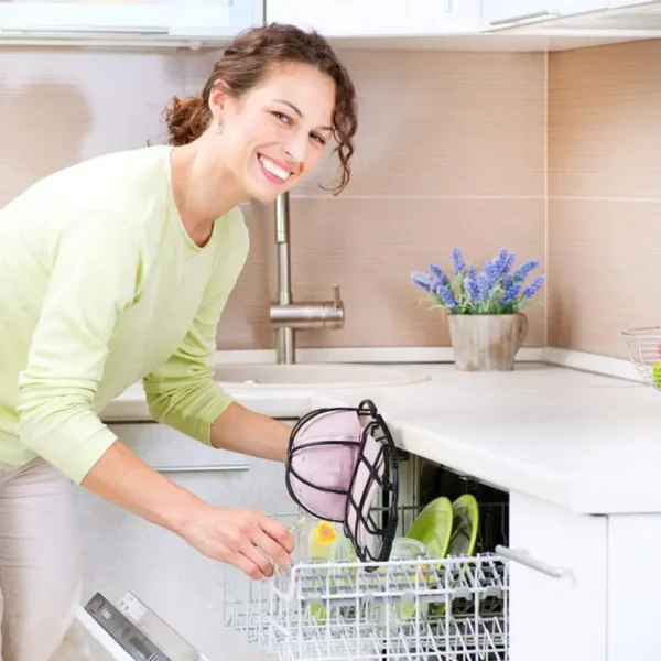 Woman placing pink hat in dishwasher.